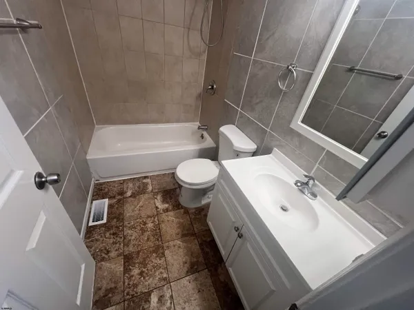 a bathroom with a sink and toilet