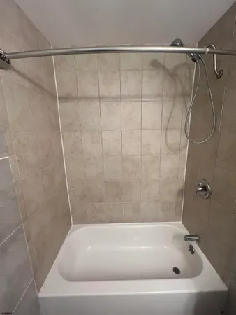 a bathroom with a bath tub