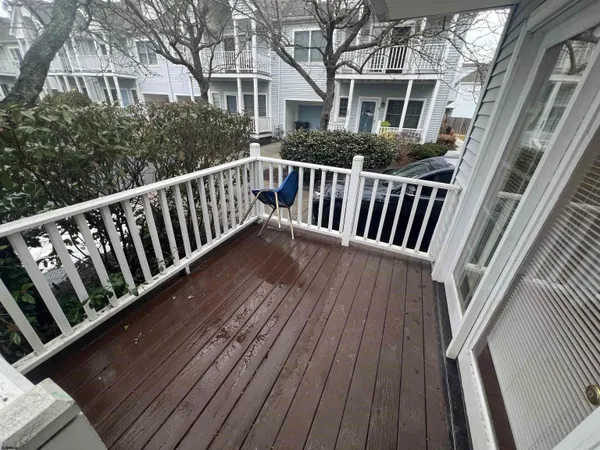 a view of balcony with wooden floor