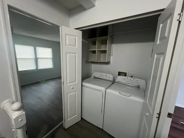 a utility room with dryer and washer