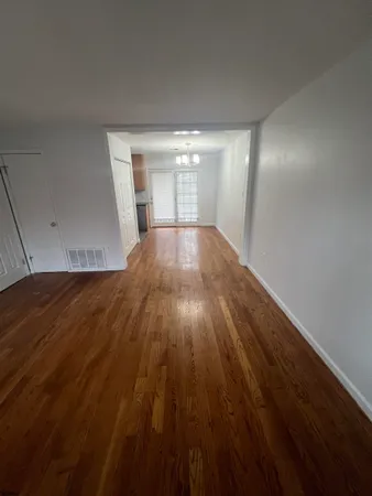 wooden floor in a hall with an entryway