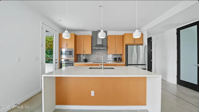 a bathroom with a sink a mirror and a bathtub