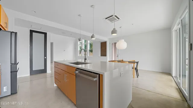 a bathroom with a double vanity sink a mirror and a bathtub