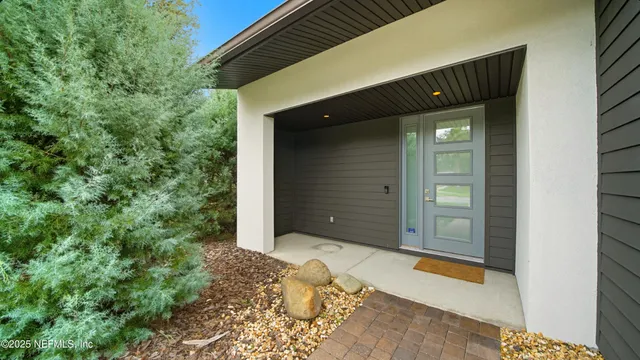 a kitchen with stainless steel appliances a refrigerator sink and cabinets