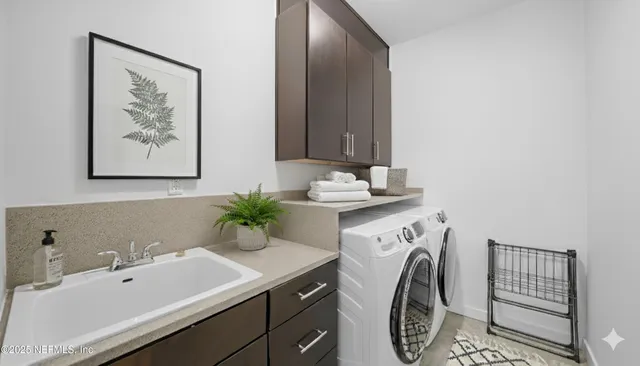a living room with a baby crib furniture and a window