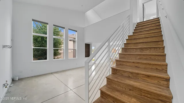 a view of a house with backyard and porch