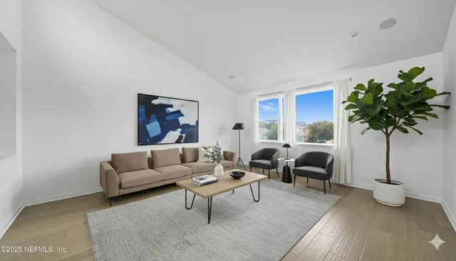 a view of a lake with houses in the back