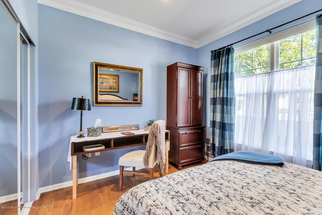 a bedroom with a bed and a table in it