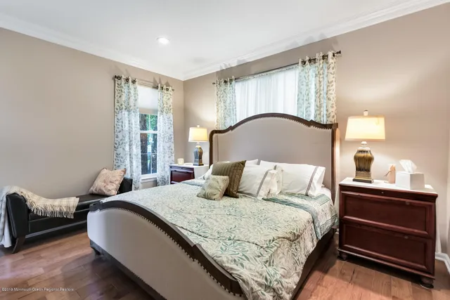 a bedroom with a bed and lamp