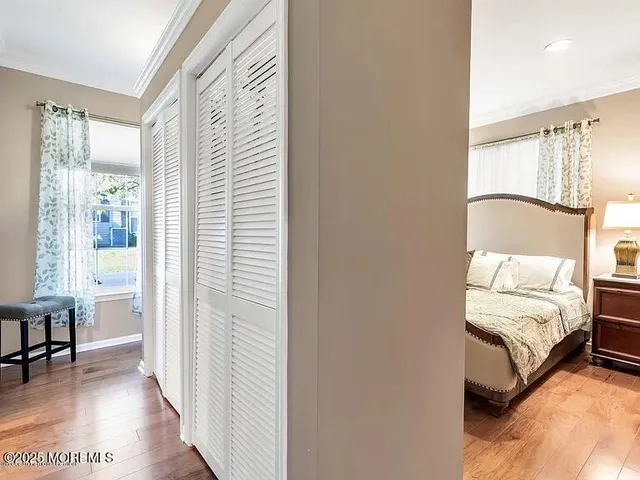 a bedroom with furniture and a window