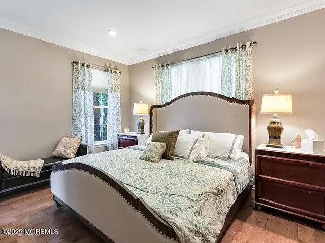 a bedroom with a large bed and a dresser
