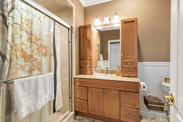 a bathroom with a double vanity sink mirror and