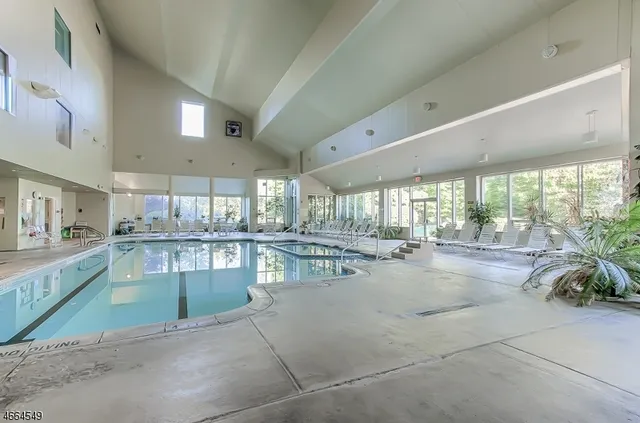 a dining hall with stainless steel appliances granite countertop a large window