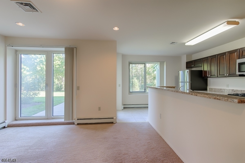 1000 Gates Court, Unit 1047 Morris Plains, NJ 07950 - Photo 7 of 21 a view of a kitchen with furniture and a window