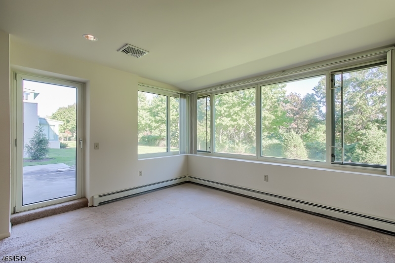 1000 Gates Court, Unit 1047 Morris Plains, NJ 07950 - Photo 9 of 21 a view of an empty room with a window