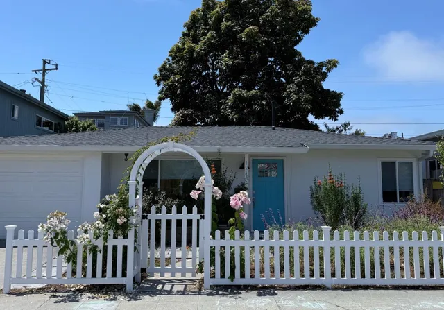 a front view of house with small garden
