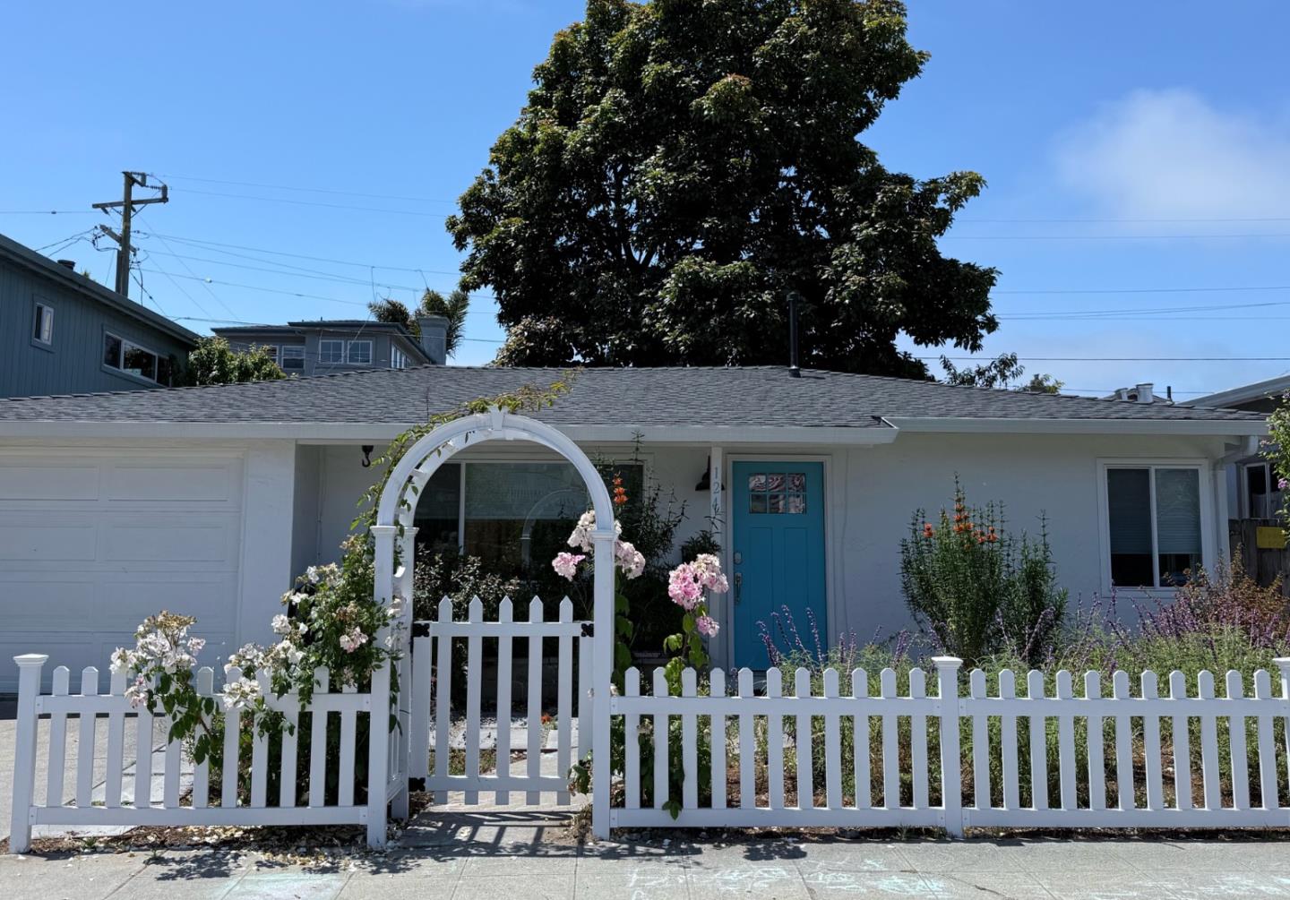 a front view of house with small garden