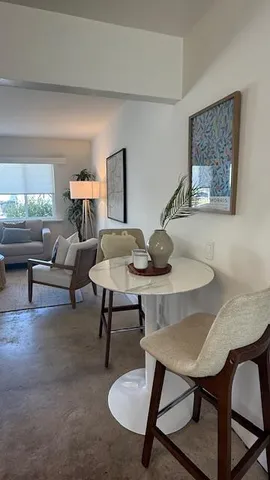 a view of a workspace with furniture