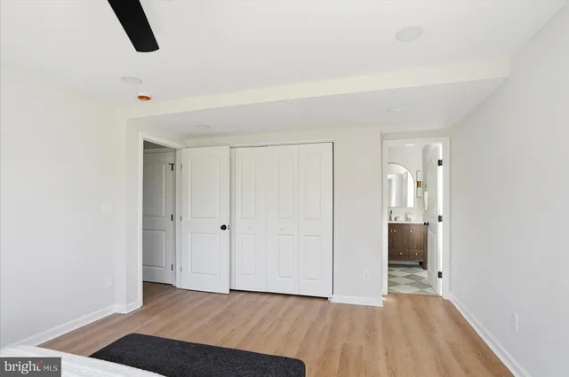 a bathroom with a shower and a glass door