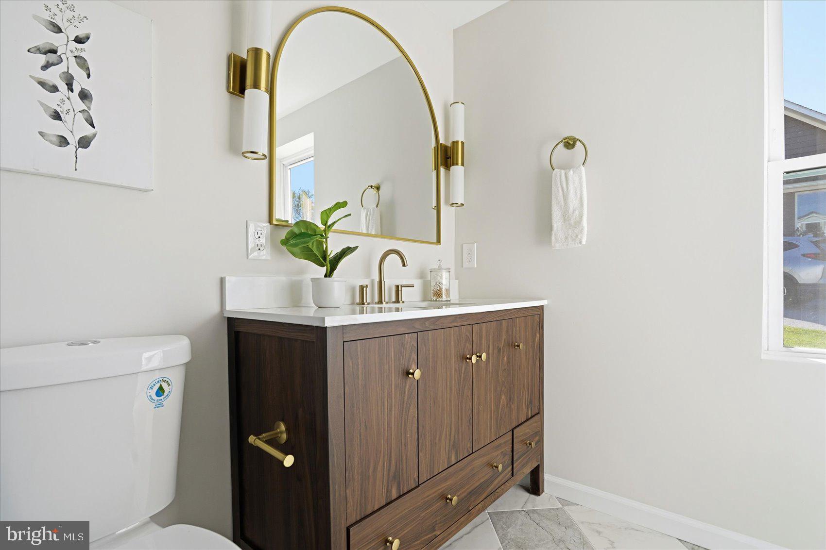 2105 Stringtown Road Sparks Glencoe, MD 21152 - Photo 23 of 57 a bathroom with a sink a toilet and mirror