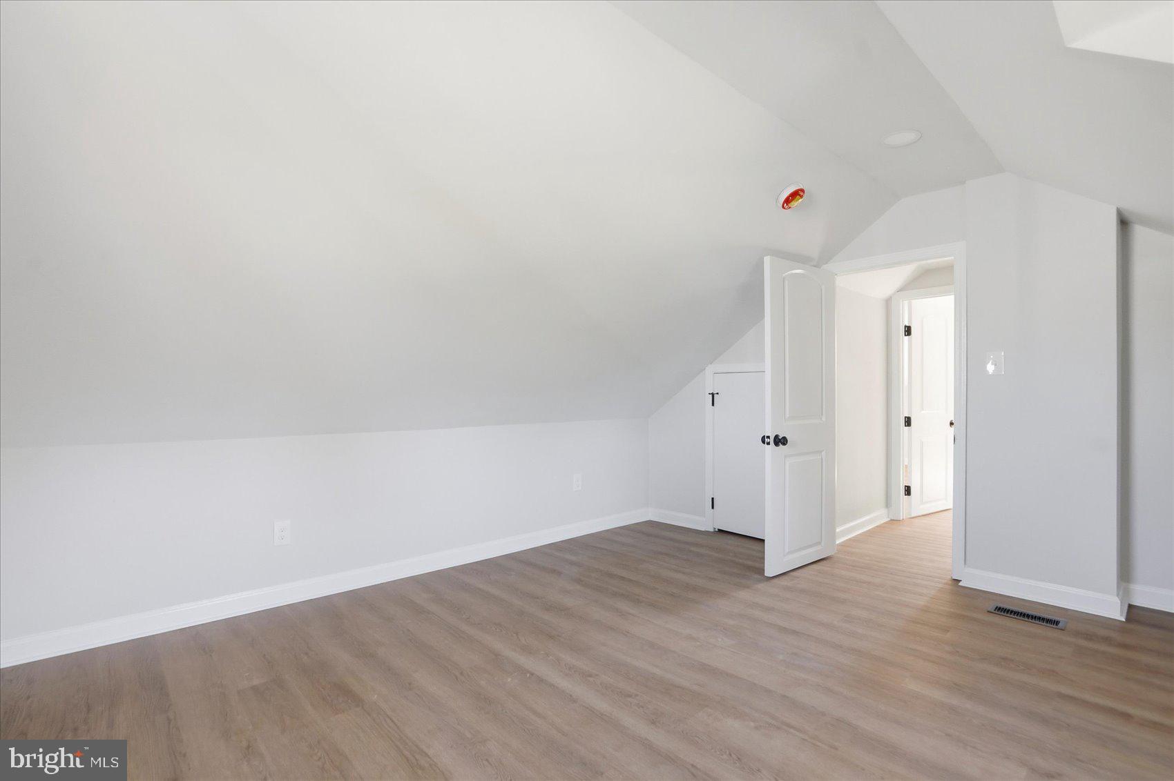 2105 Stringtown Road Sparks Glencoe, MD 21152 - Photo 28 of 57 an empty room with wooden floor and windows