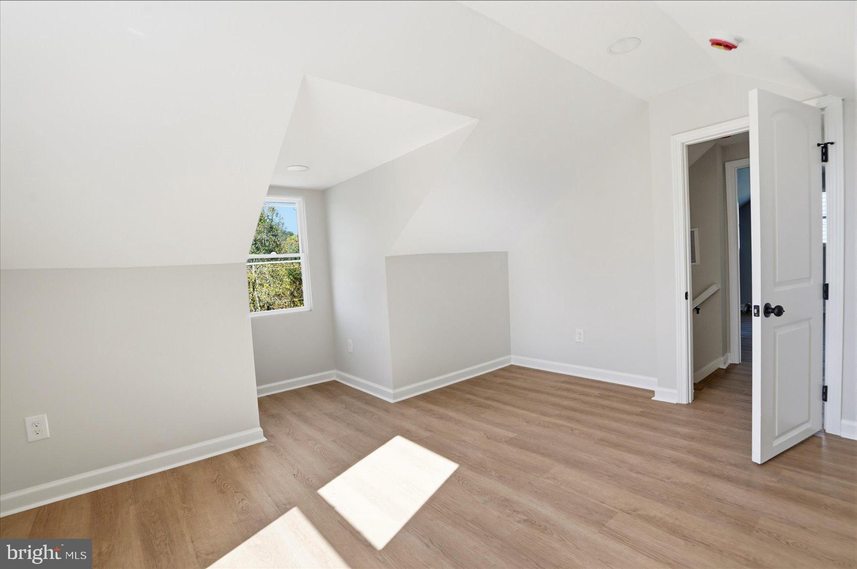 2105 Stringtown Road Sparks Glencoe, MD 21152 - Photo 29 of 57 an empty room with wooden floor and windows