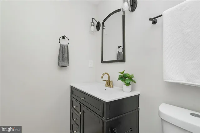 a room with a mirror and a cabinet