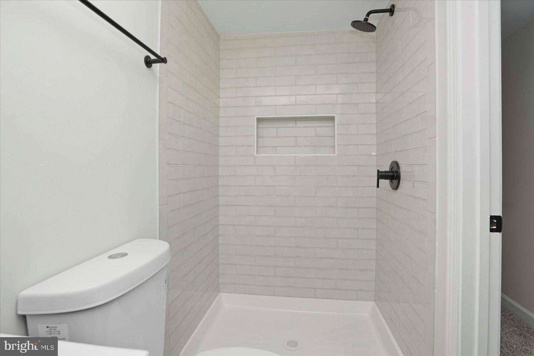 2105 Stringtown Road Sparks Glencoe, MD 21152 - Photo 32 of 57 a bathroom with a shower a toilet and a shower