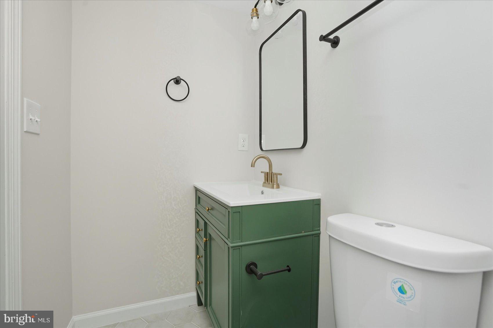 2105 Stringtown Road Sparks Glencoe, MD 21152 - Photo 33 of 57 a bathroom with a sink a toilet and mirror