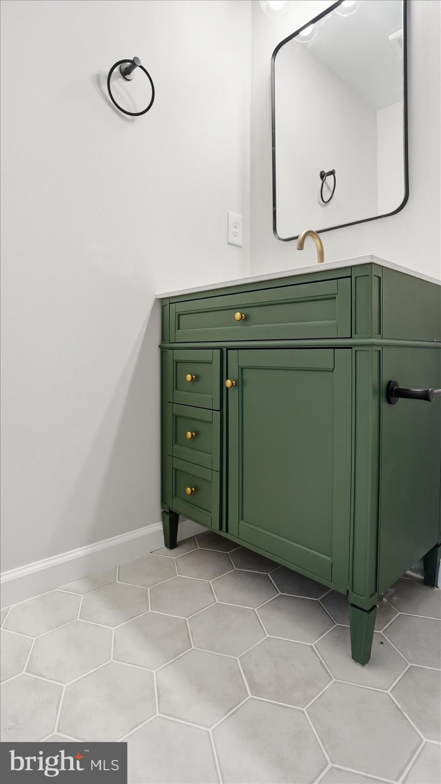 2105 Stringtown Road Sparks Glencoe, MD 21152 - Photo 34 of 57 a room with a mirror and a cabinet