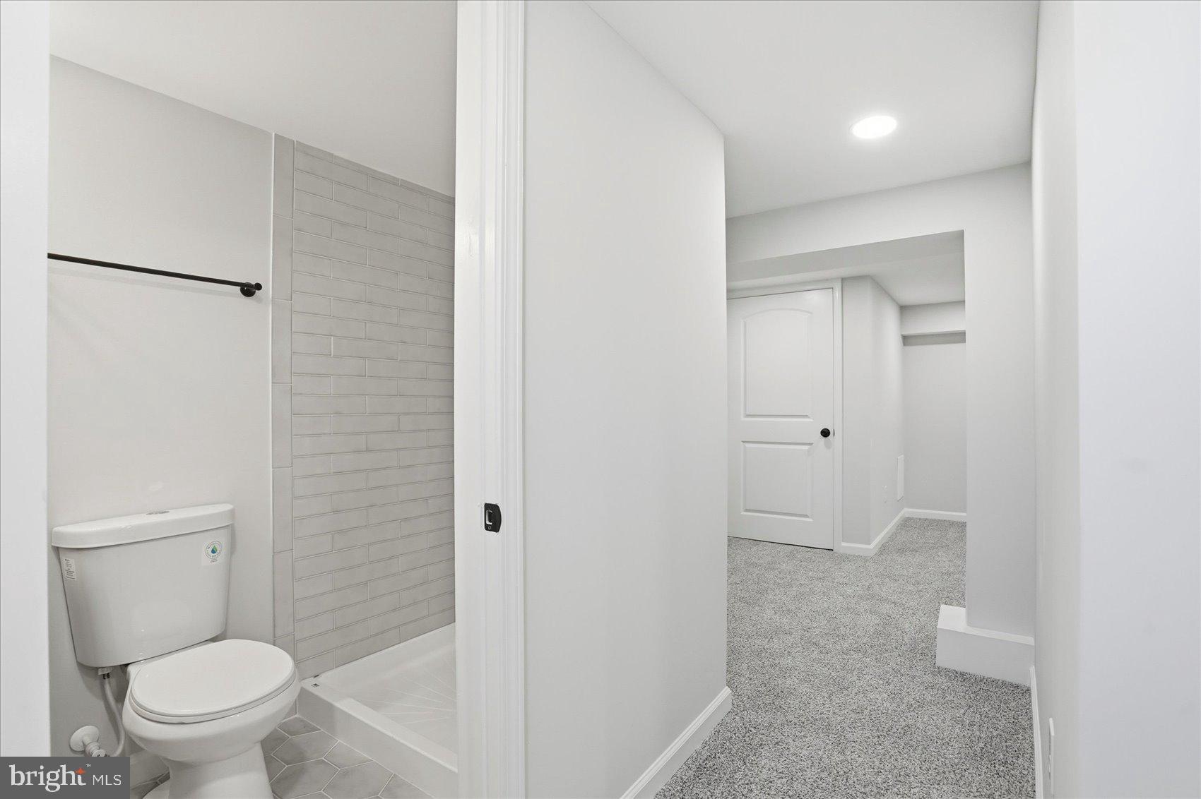 2105 Stringtown Road Sparks Glencoe, MD 21152 - Photo 41 of 57 a bathroom with a granite countertop sink toilet and shower