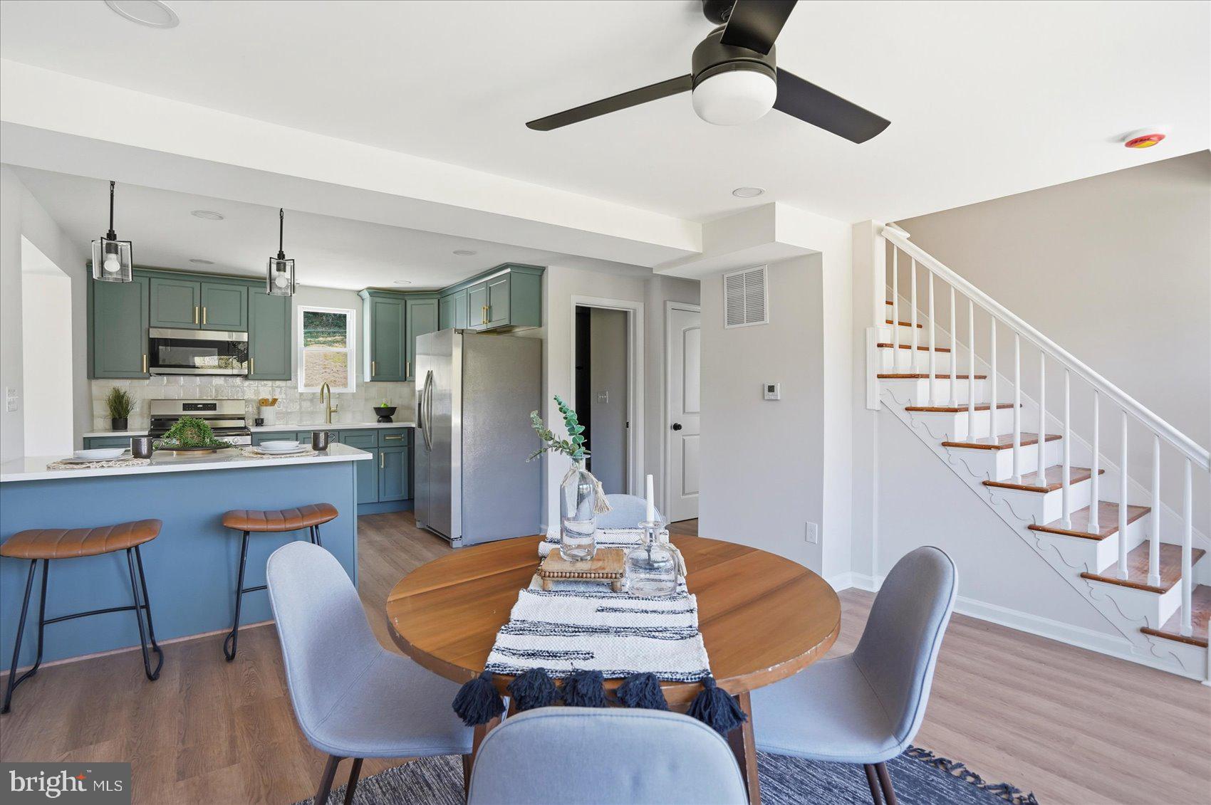 2105 Stringtown Road Sparks Glencoe, MD 21152 - Photo 8 of 57 a dining room with furniture a chandelier and wooden floor