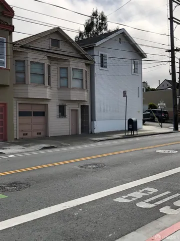 a view of a house with a street