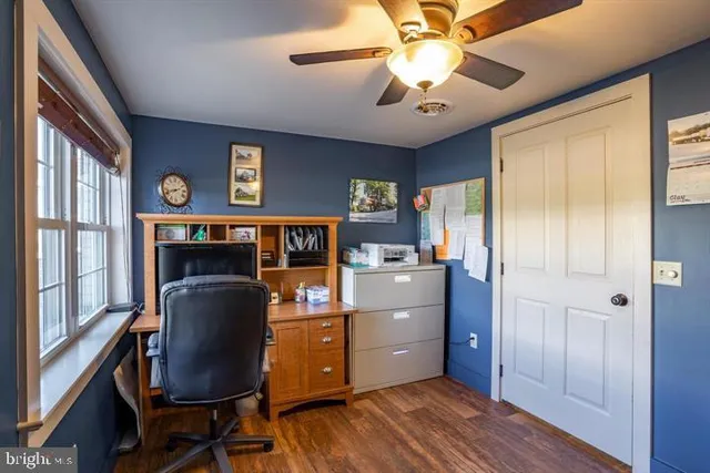 a view of a garage with rack and bicycle