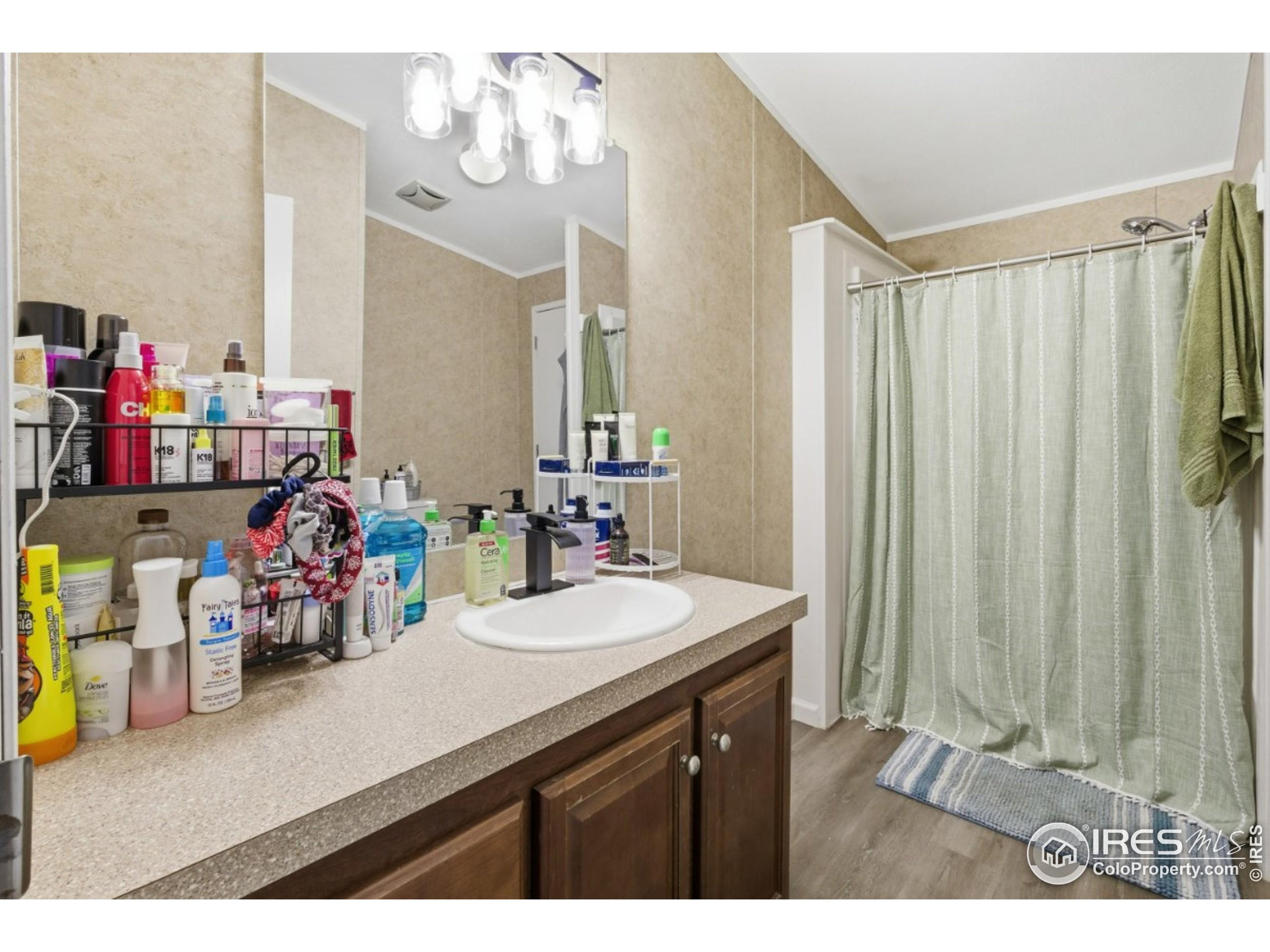 2500 East Harmony Road, Unit 84 Fort Collins, CO 80528 - Photo 15 of 18 a bathroom with a sink mirror and vanity