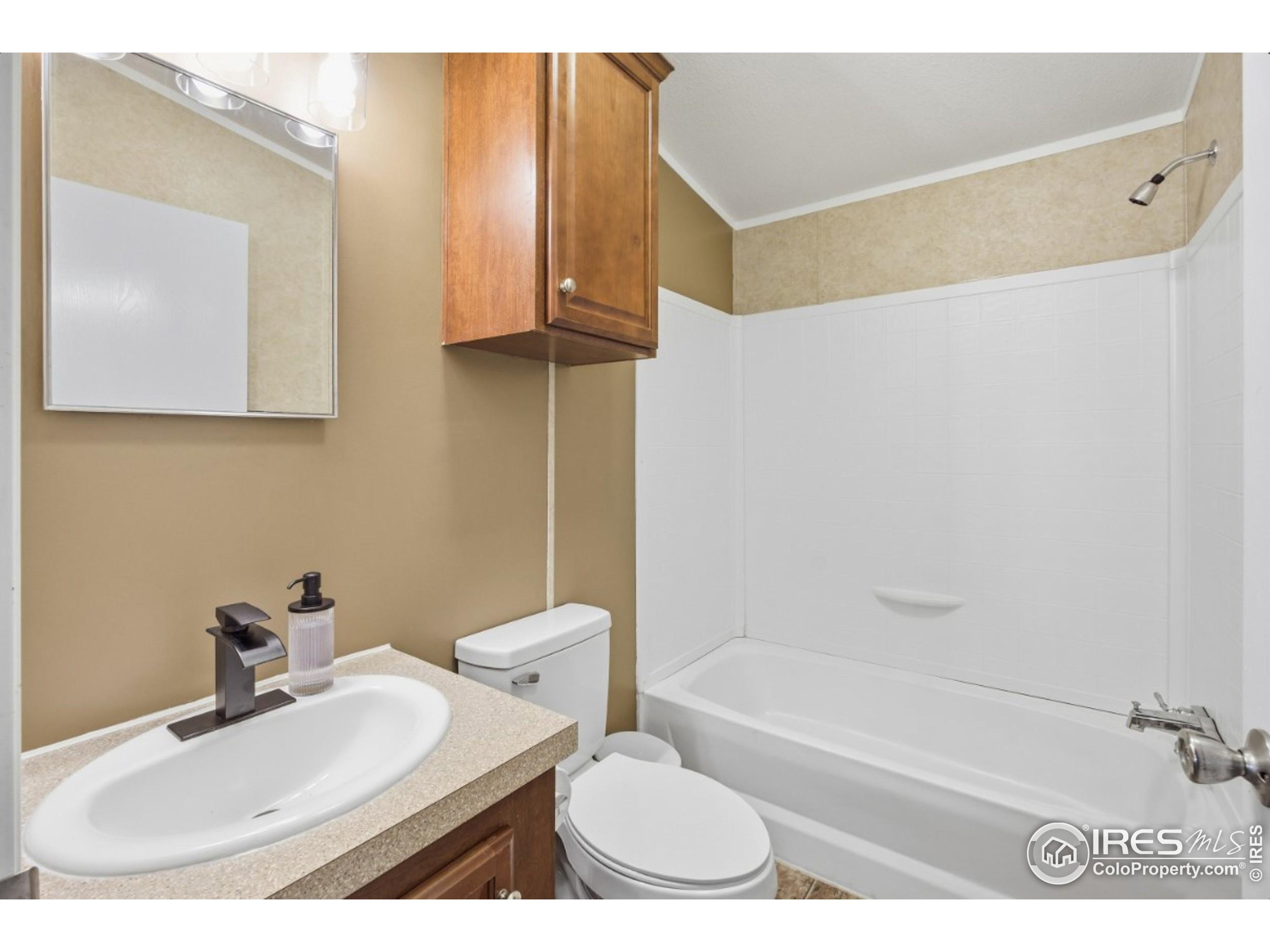 2500 East Harmony Road, Unit 84 Fort Collins, CO 80528 - Photo 17 of 18 a bathroom with a sink a toilet and bathtub