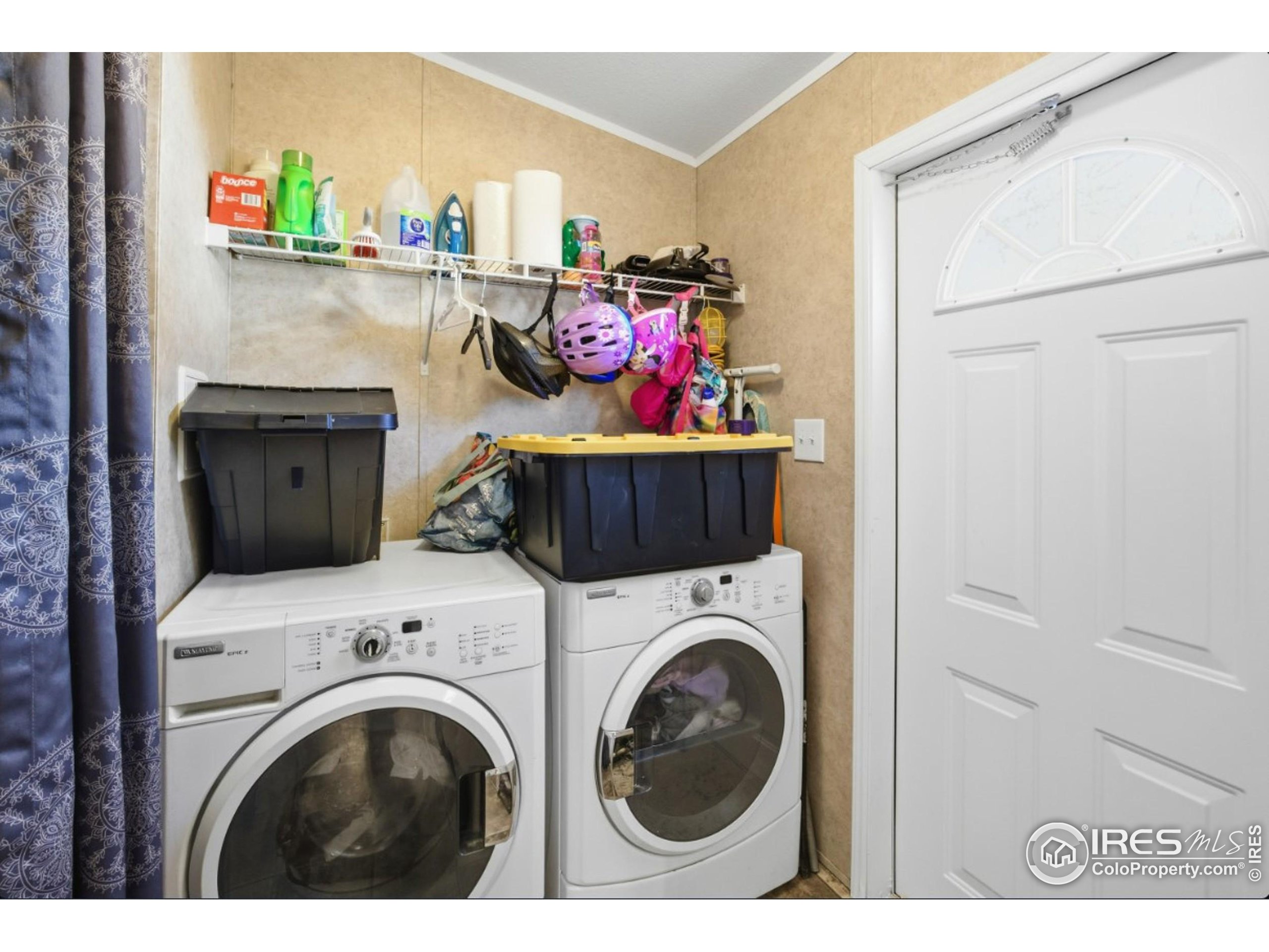 2500 East Harmony Road, Unit 84 Fort Collins, CO 80528 - Photo 18 of 18 a utility room with dryer and washer