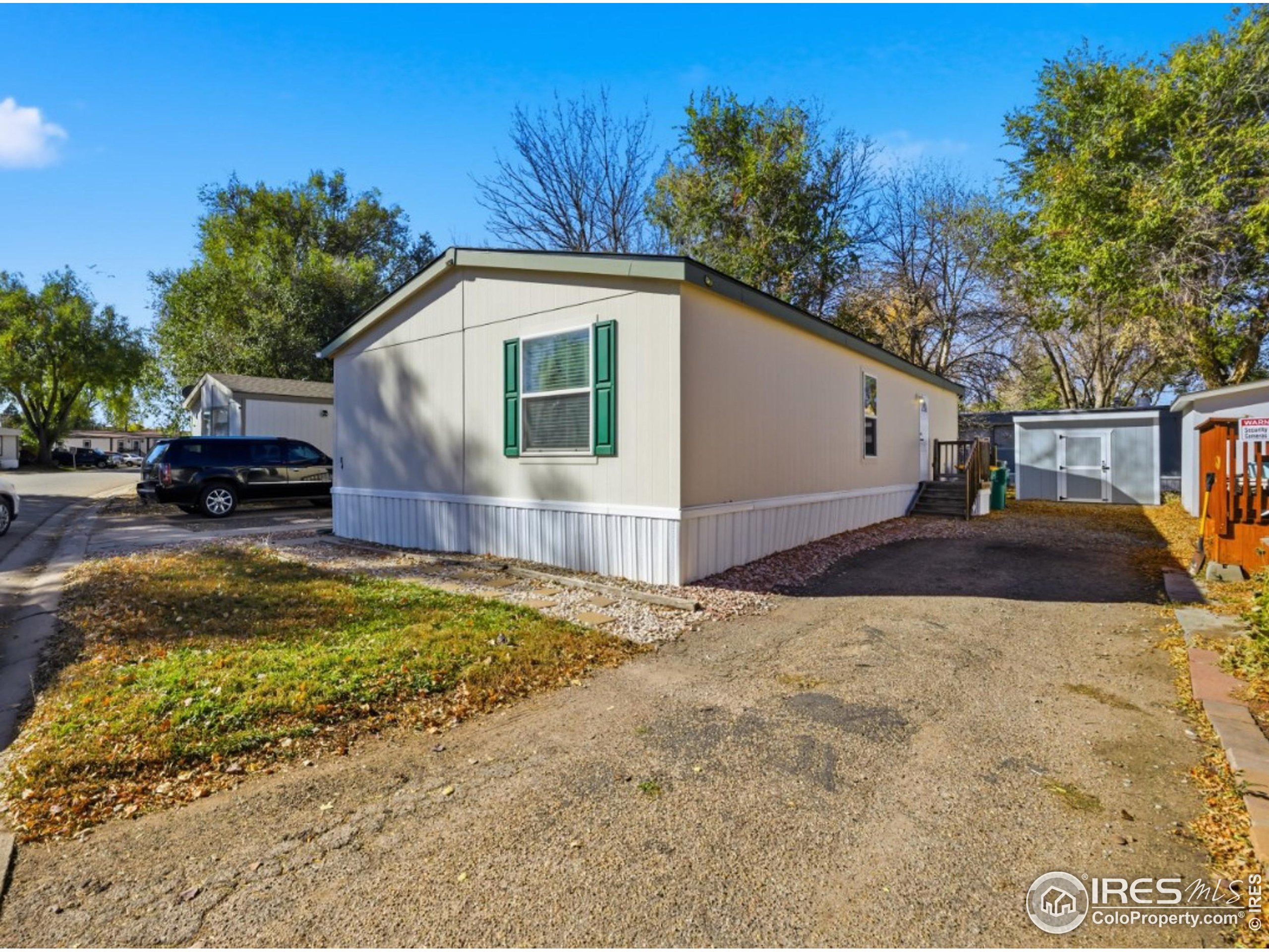 2500 East Harmony Road, Unit 84 Fort Collins, CO 80528 - Photo 4 of 18 a front view of a house with a yard