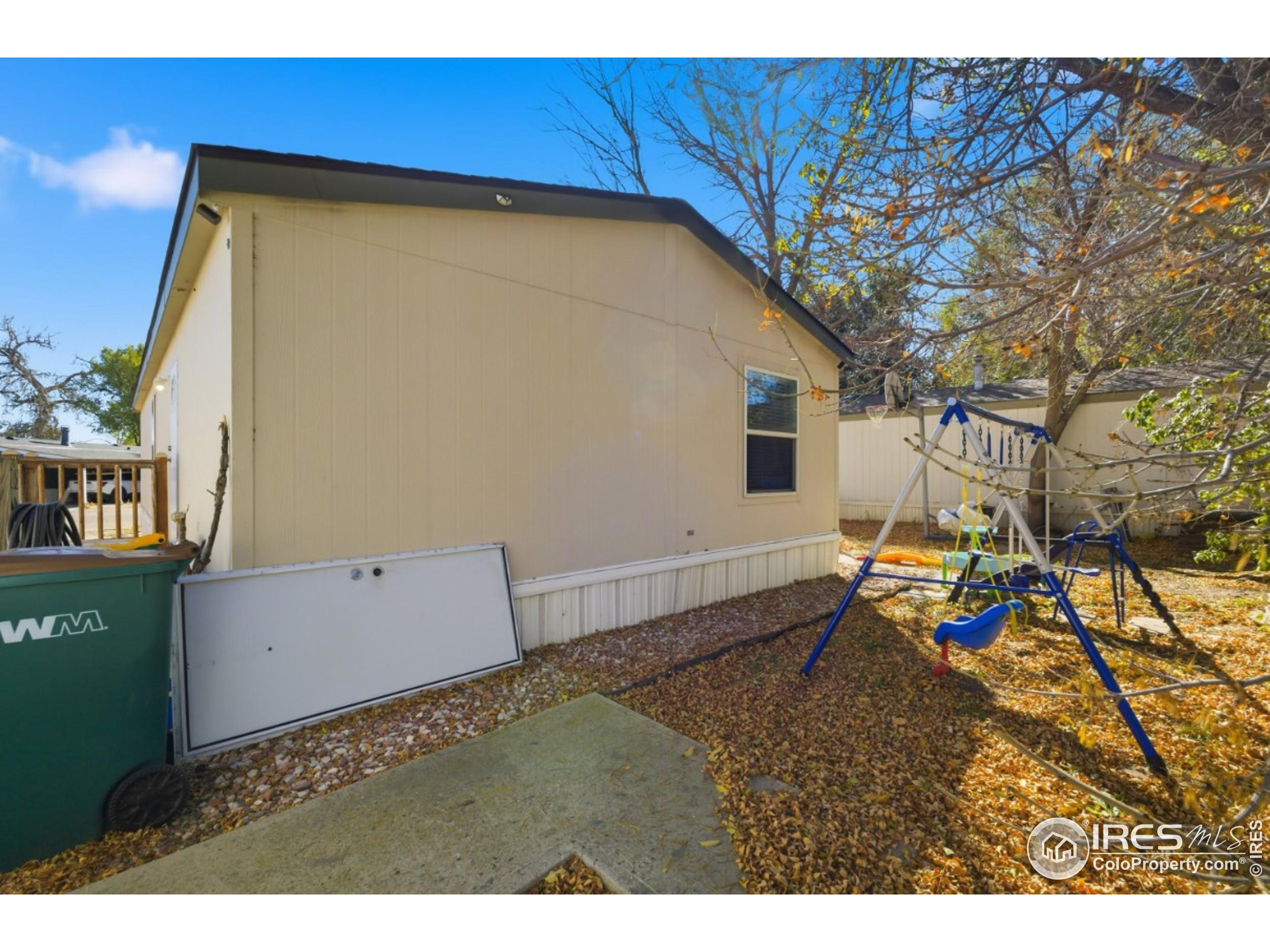 2500 East Harmony Road, Unit 84 Fort Collins, CO 80528 - Photo 5 of 18 a backyard of a house with table and chairs