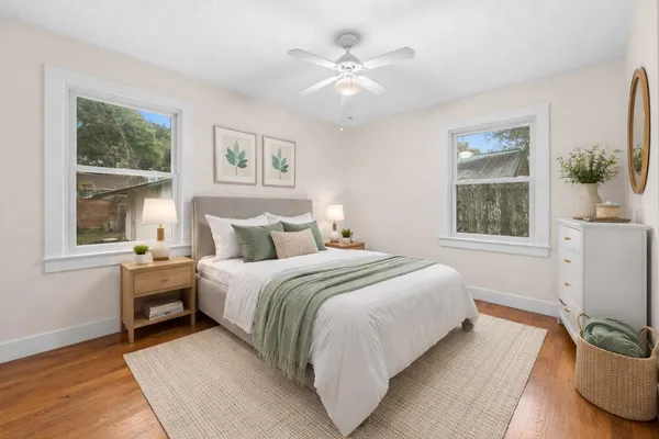a bedroom with a large bed and a window