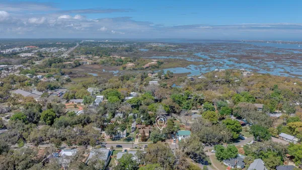 an aerial view of multiple house with outdoor space