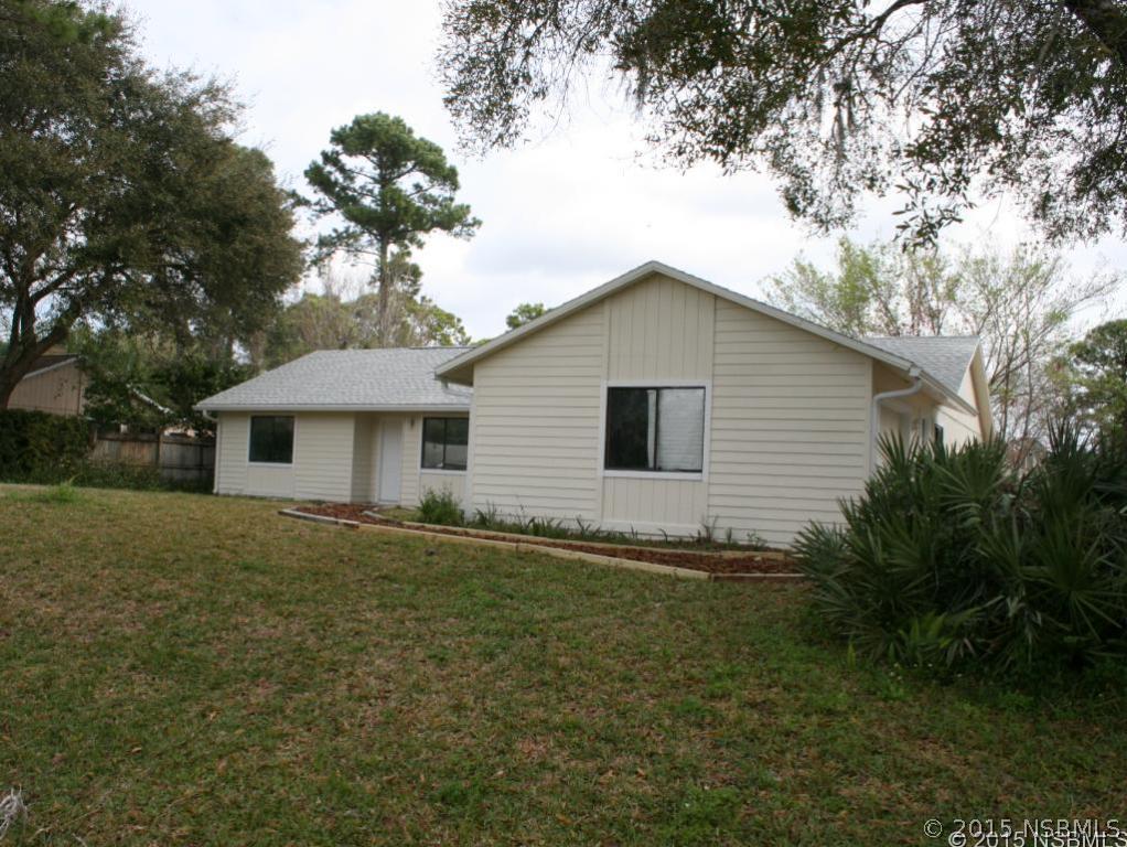 2429 Unity Tree Drive Edgewater, FL 32141 - Photo 1 of 24 a view of a house with a yard