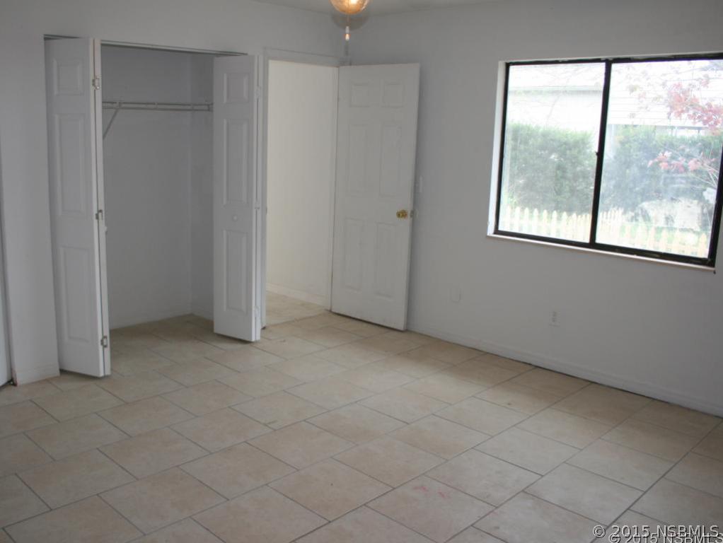 2429 Unity Tree Drive Edgewater, FL 32141 - Photo 12 of 24 an empty room with windows