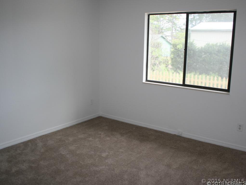 2429 Unity Tree Drive Edgewater, FL 32141 - Photo 14 of 24 an empty room with a window
