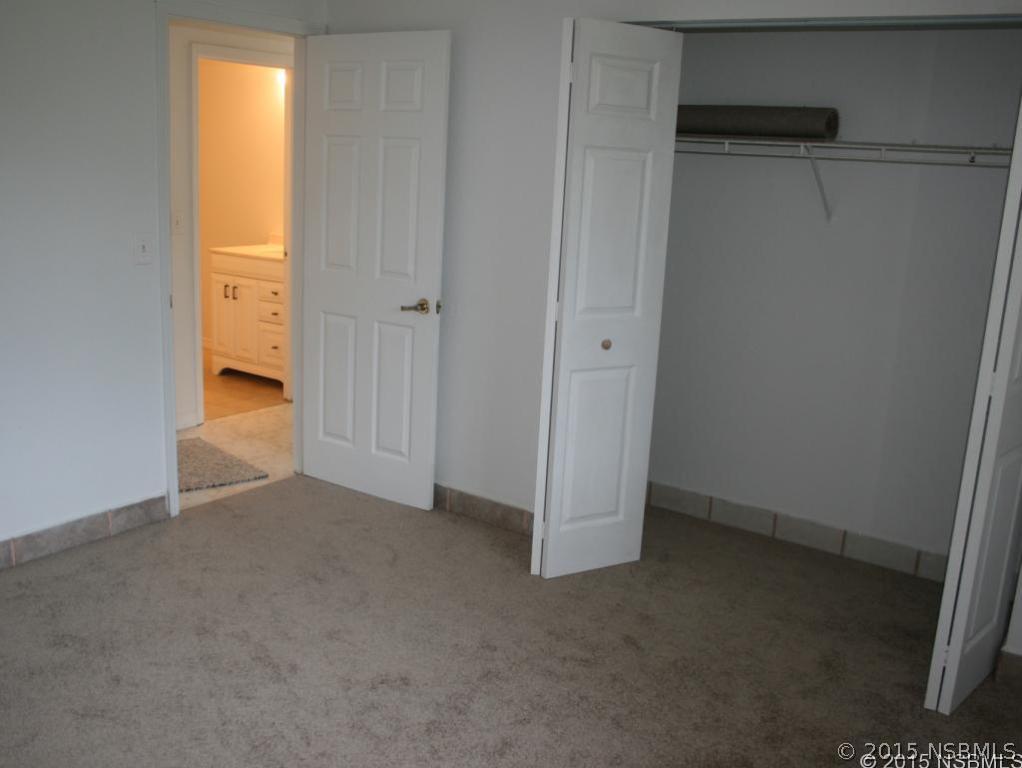 2429 Unity Tree Drive Edgewater, FL 32141 - Photo 16 of 24 a view of an empty room with a closet