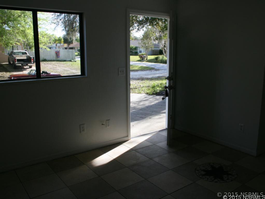 2429 Unity Tree Drive Edgewater, FL 32141 - Photo 18 of 24 a view of an empty room and window