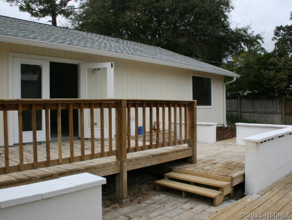 2429 Unity Tree Drive Edgewater, FL 32141 - Photo 20 of 24 a view of a patio with a table and chairs