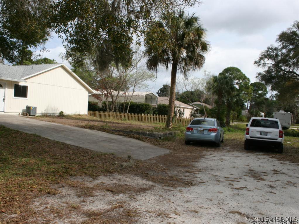2429 Unity Tree Drive Edgewater, FL 32141 - Photo 4 of 24 a car parked on the side of the road