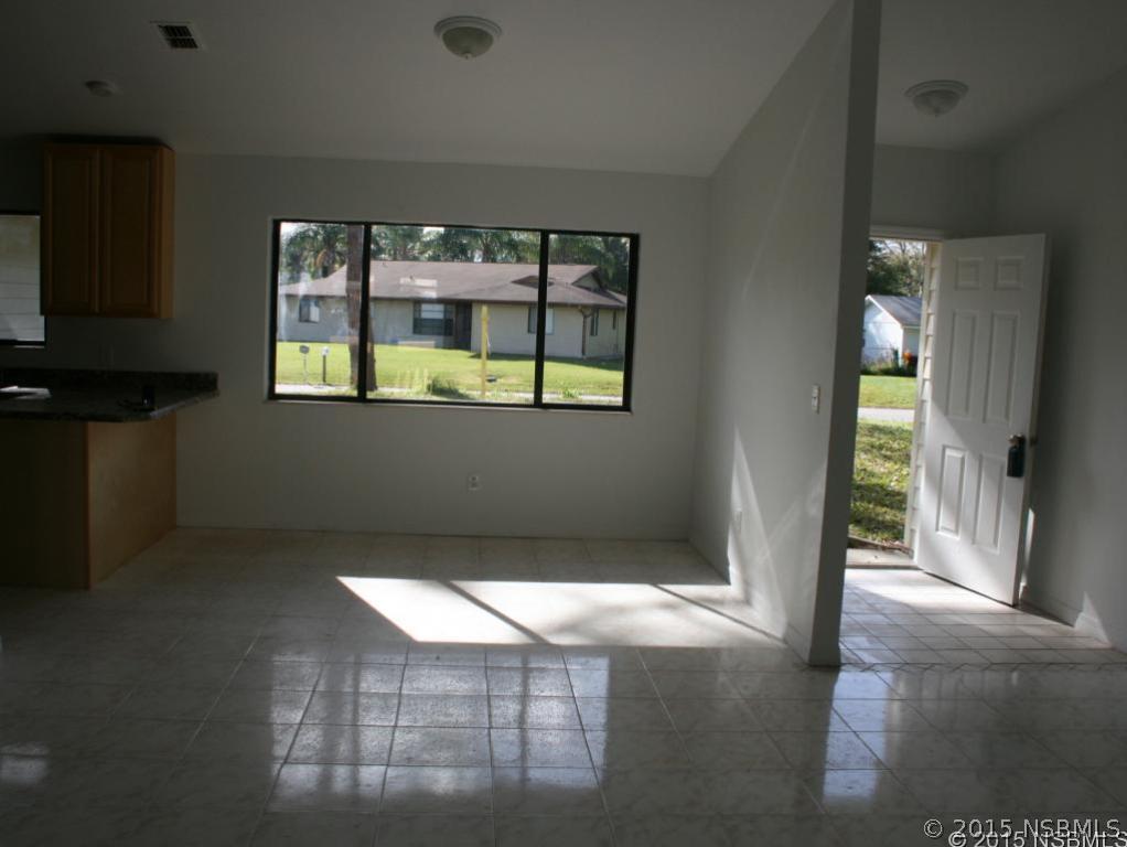 2429 Unity Tree Drive Edgewater, FL 32141 - Photo 8 of 24 a view of an empty room with a window