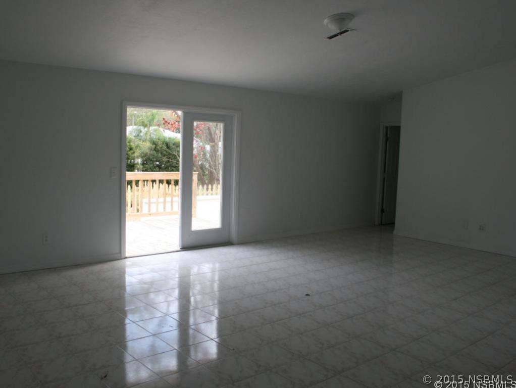 2429 Unity Tree Drive Edgewater, FL 32141 - Photo 9 of 24 an empty room with windows
